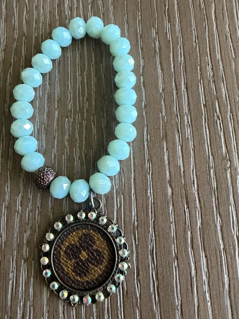 Handcrafted Mint Beaded Bracelet Stack with Crystal and Medallion LV bag.